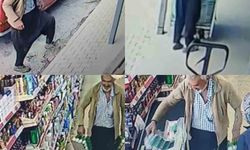 Çamurlu ayakkabısını çıkardı, çorapla markette alışveriş yaptı