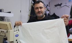 Esnaf "Kefene cep dikilir" yazısıyla ilgi odağı oldu